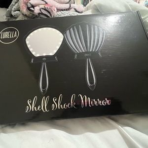 Shell shock mirror new still in box with charger cord